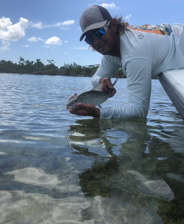 An image of Captain Kevin Grubb on a backcountry fishing trip catching bonefish in the florida keys. 