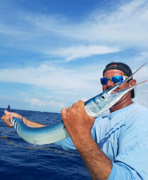 An image of Captain Grubb with a large needlefish in the lower florida keys.